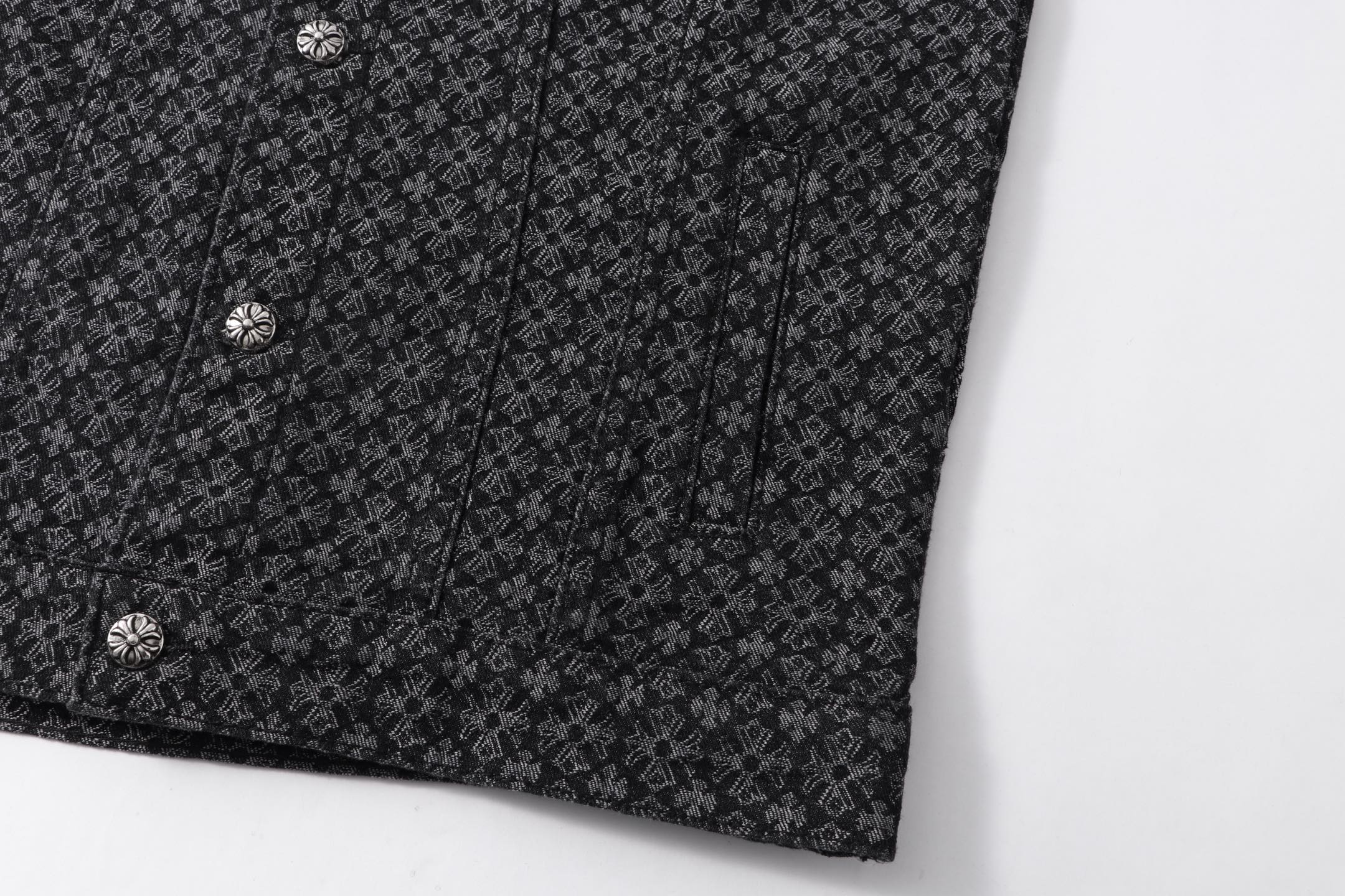 Dark patterned shirt lower front with buttons and curved hem