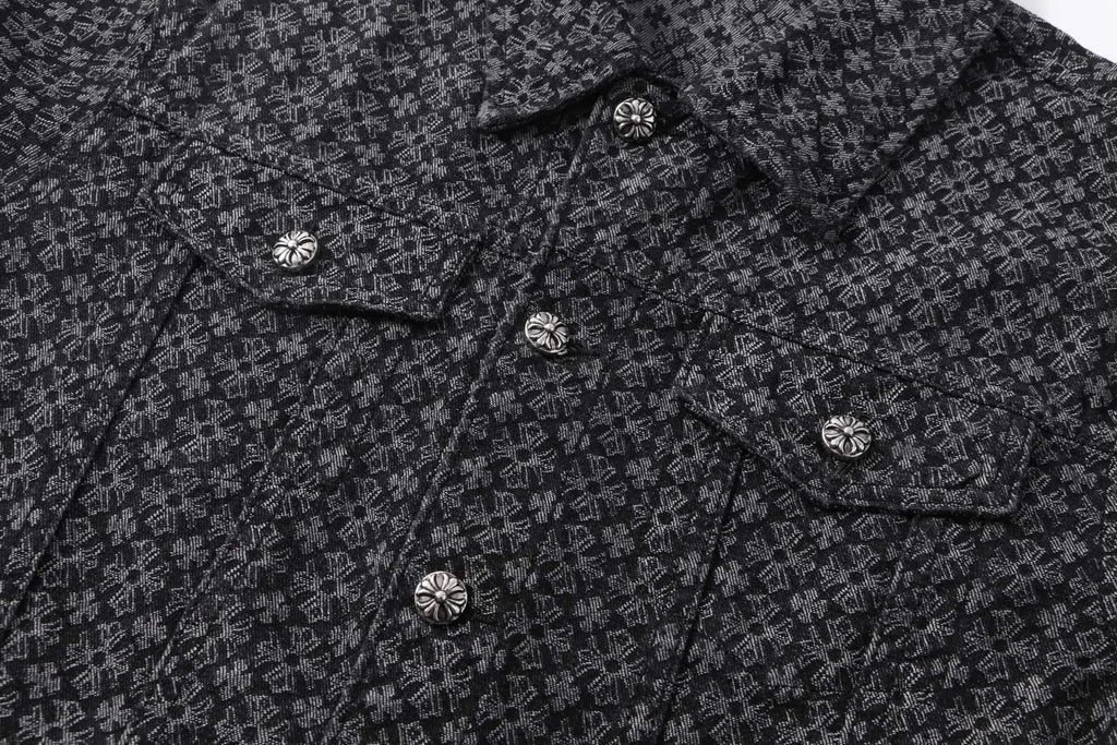 Dark patterned shirt front with small buttons along placket