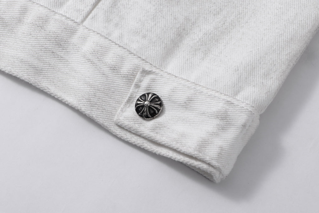 White denim jacket lower sleeve or hem with dark round button