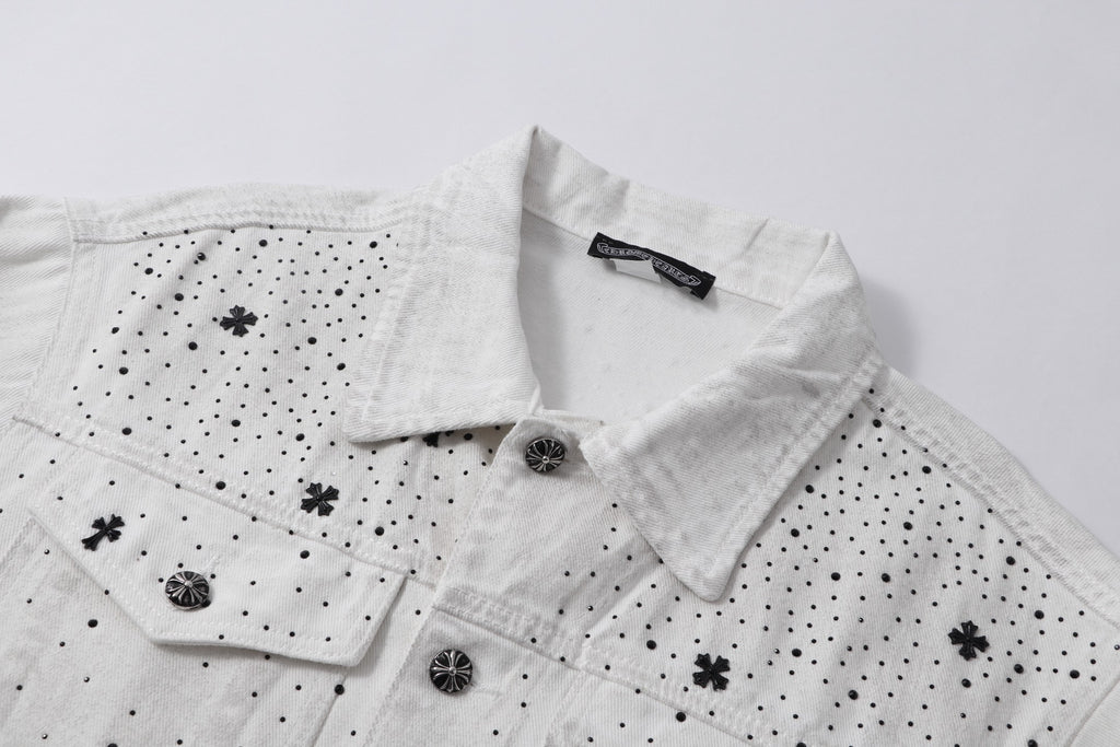 White denim jacket collar and button placket with embroidered cross and dot details