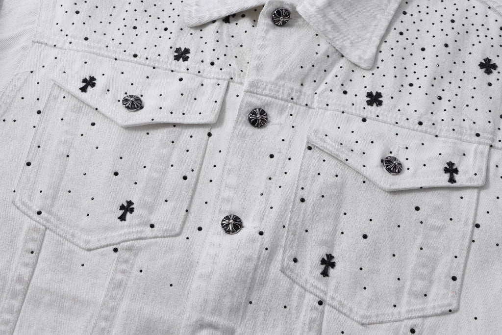 White denim jacket front with flap pockets, button placket, and embroidered cross and dot pattern