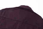 Shoulder and upper back detail on dark plum long-sleeve jacket with speckle embroidery