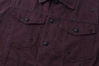 Chest pocket and button detail on dark plum long-sleeve jacket