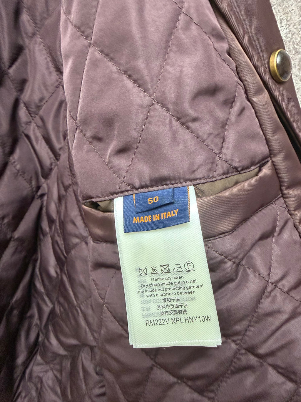 Quilted long coat label on inner seam, mauve fabric