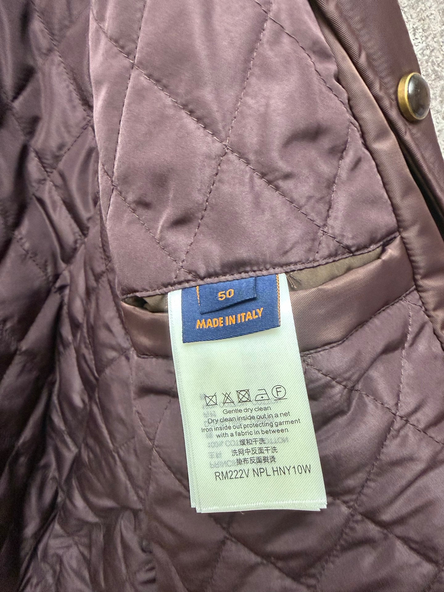 Quilted long coat label on inner seam, mauve fabric