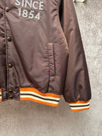 Louis Vuitton long bomber jacket, lower front view with orange-and-cream rib hem stripes