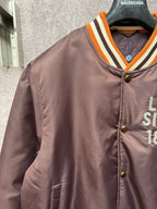 Louis Vuitton long bomber jacket with orange-striped V-neck rib collar and logo details