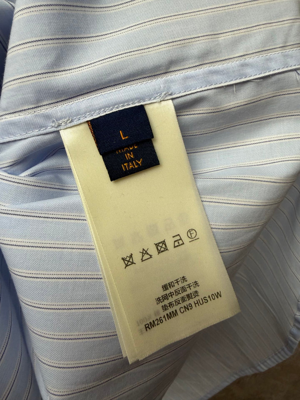 Louis Vuitton striped shirt care label on inner neckline