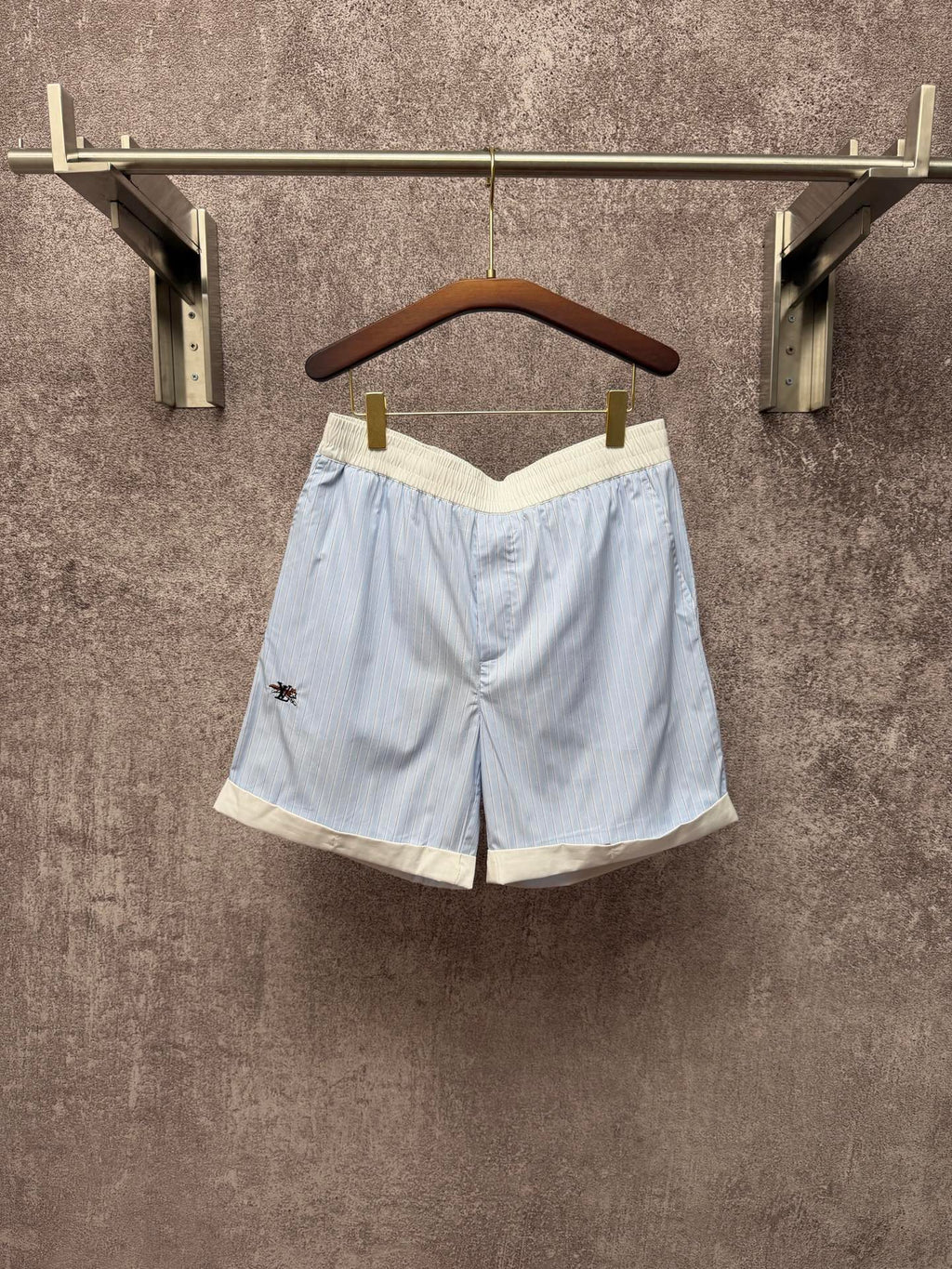 Light blue pinstripe shorts with cream trim, elastic waistband, Louis Vuitton