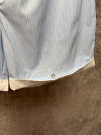 Light blue pinstripe shorts with cream hem band and front button closure, Louis Vuitton