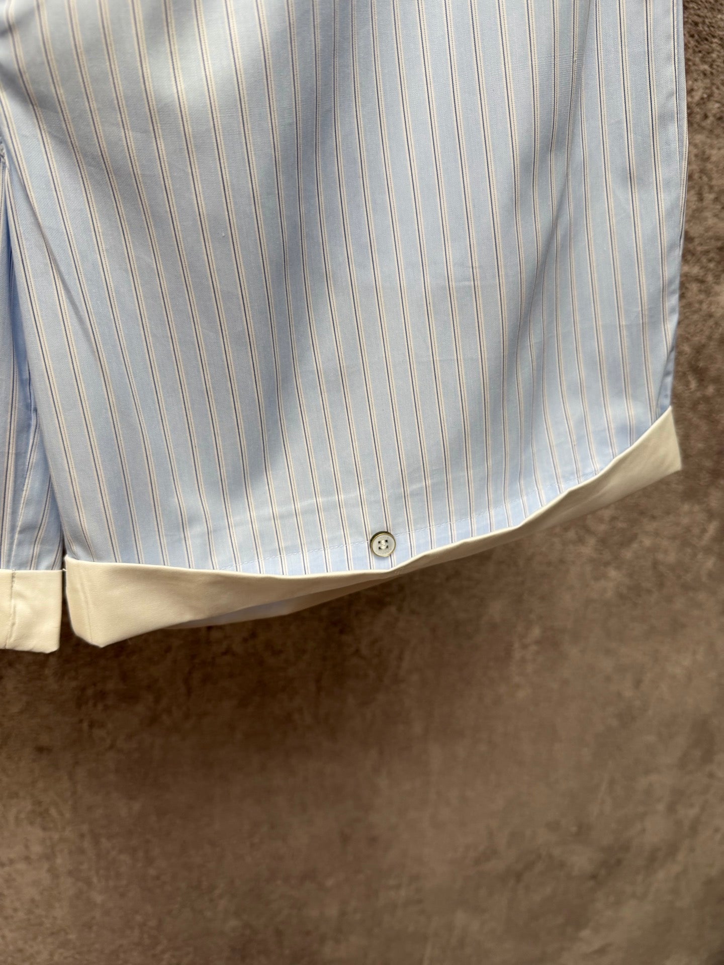 Light blue pinstripe shorts with cream hem band and front button closure, Louis Vuitton