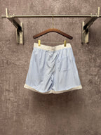 Light blue pinstripe shorts with elastic waist and cream trim, Louis Vuitton
