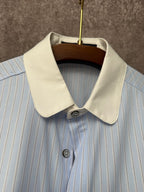 Light blue striped short-sleeve shirt with cream pointed collar and top button