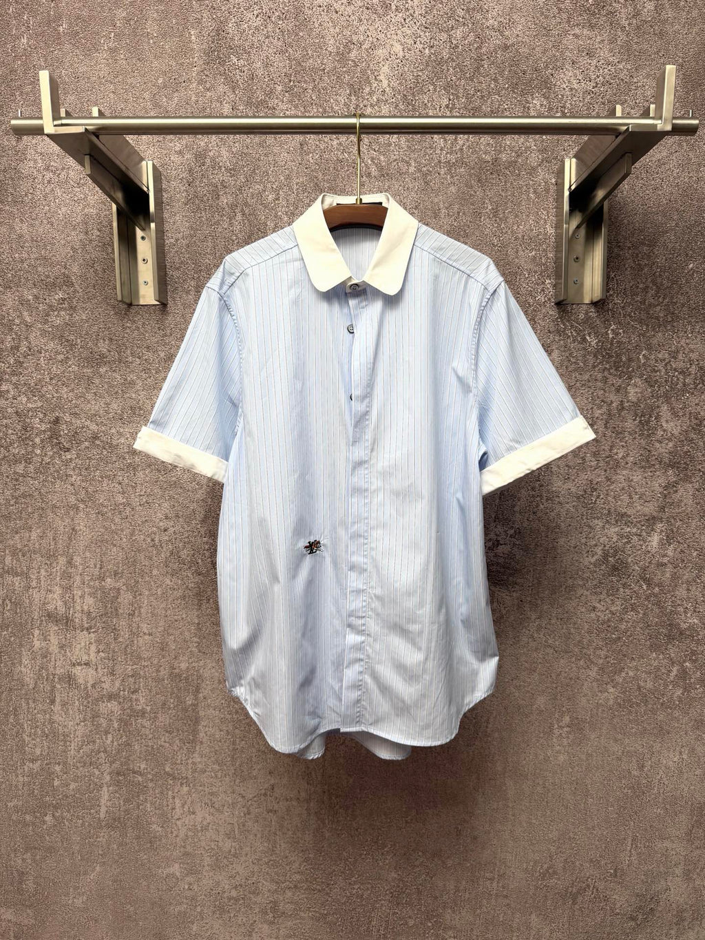 Light blue striped short-sleeve button shirt with cream pointed collar and cuffs