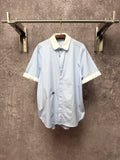 Light blue striped short-sleeve button shirt with cream pointed collar and cuffs