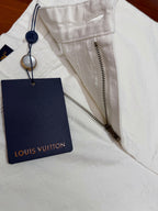 White shorts with Louis Vuitton hang tag and fabric zipper trim
