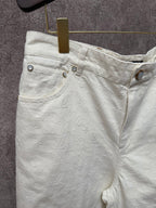 White shorts waistband with metal buttons and zipper fly