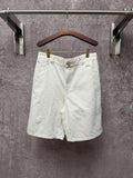 White shorts with button closure, belt loops, and front slant pockets