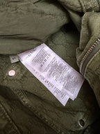 Green Gucci shorts fabric with care label near button