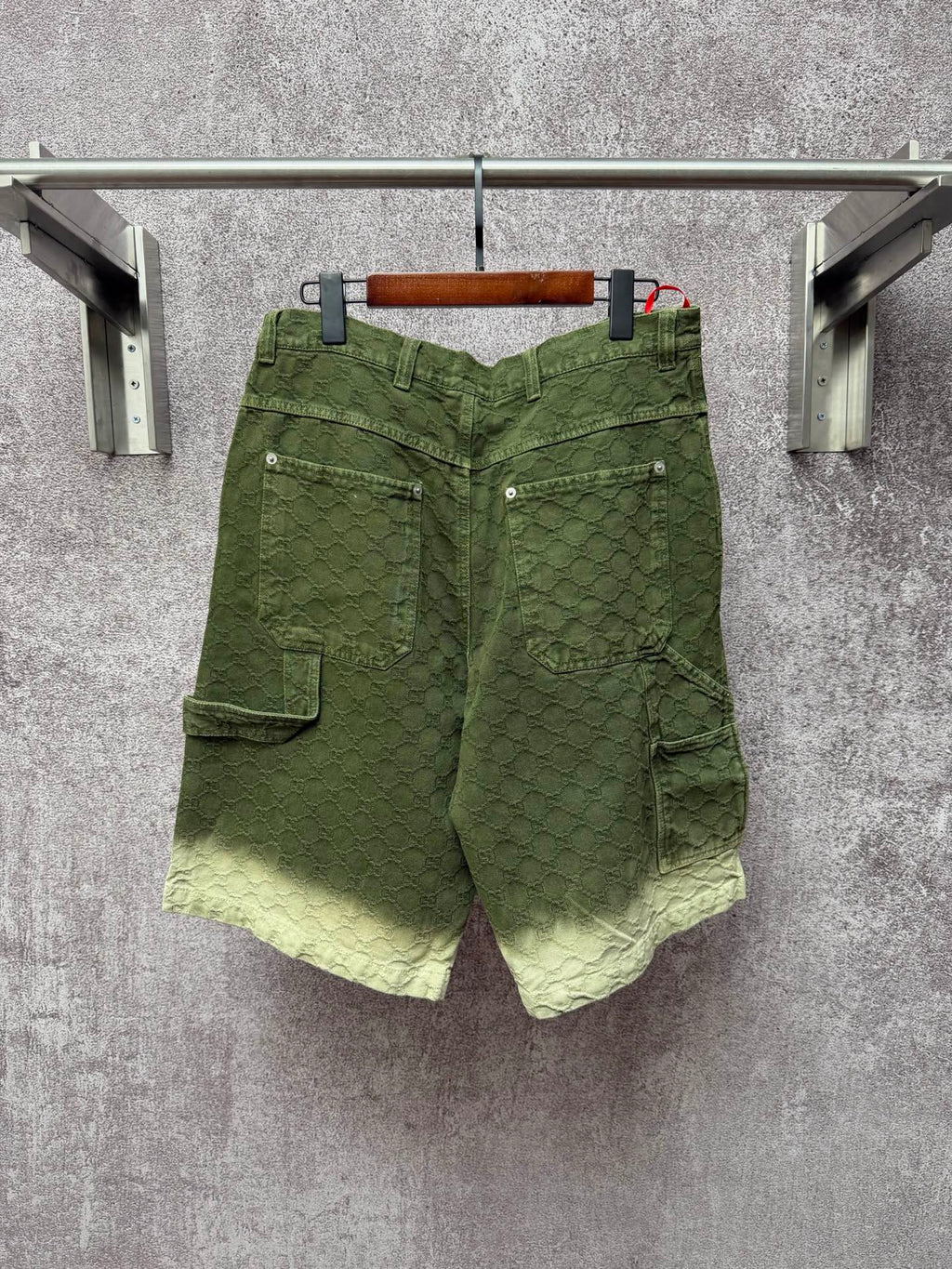 Green Gucci shorts with multiple pockets and belt loops, button closure