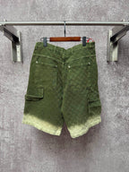 Green Gucci shorts with multiple pockets and belt loops, button closure