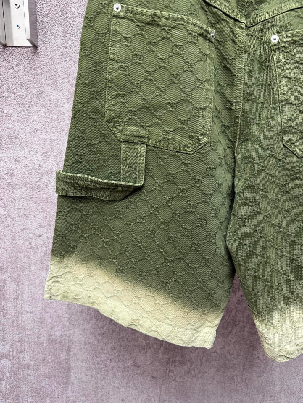 Green Gucci shorts with cargo-style side pocket and monogram fabric