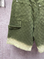 Green Gucci shorts with cargo-style side pocket and monogram fabric