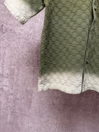 Gucci short-sleeve shirt side seam and hem, olive green textured fabric