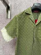 Gucci short-sleeve shirt, olive green textured pattern, open collar and front buttons