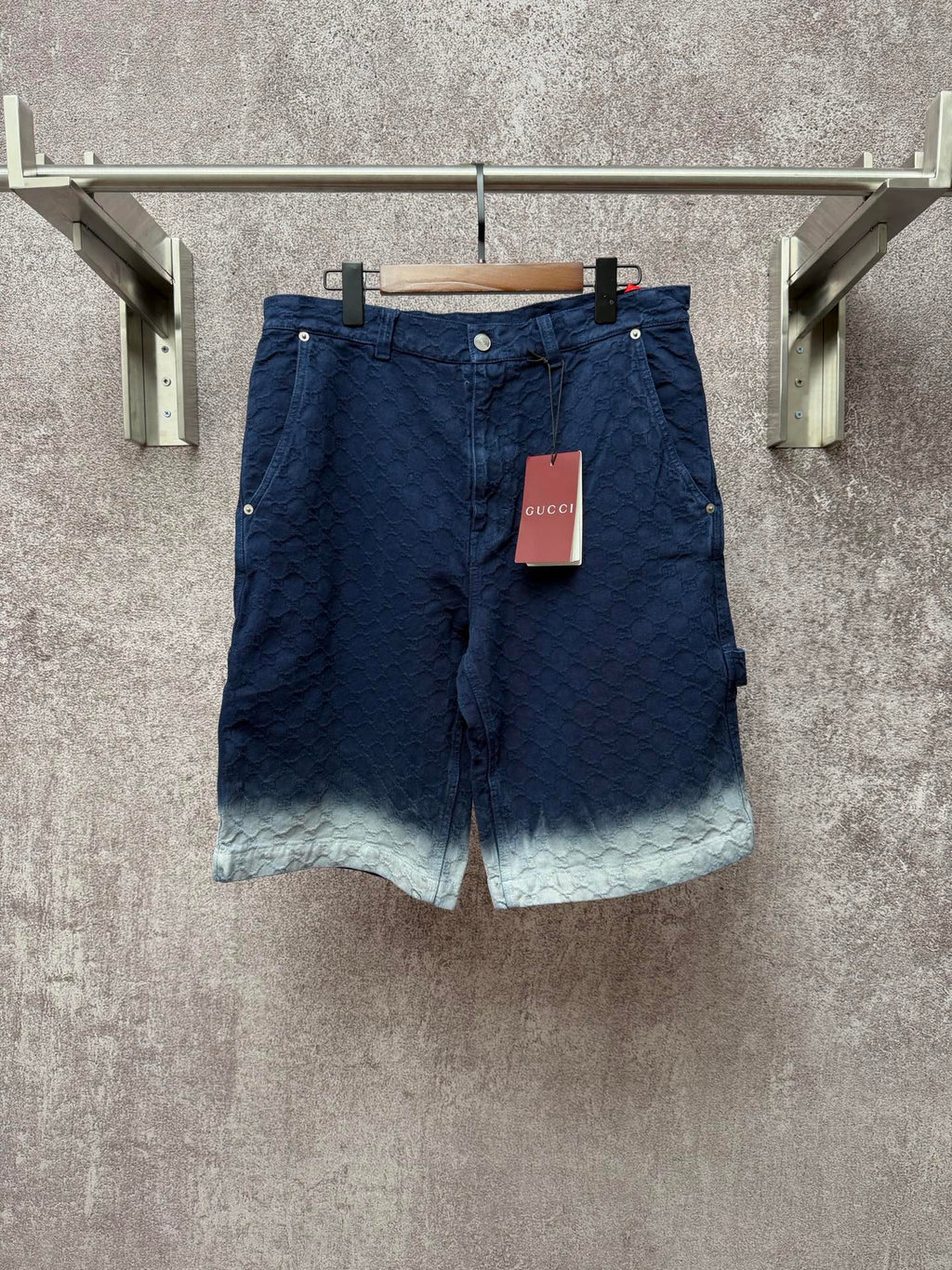 Gucci navy shorts with quilted texture and button front, light ombre hem