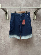 Gucci navy shorts with quilted texture and button front, light ombre hem