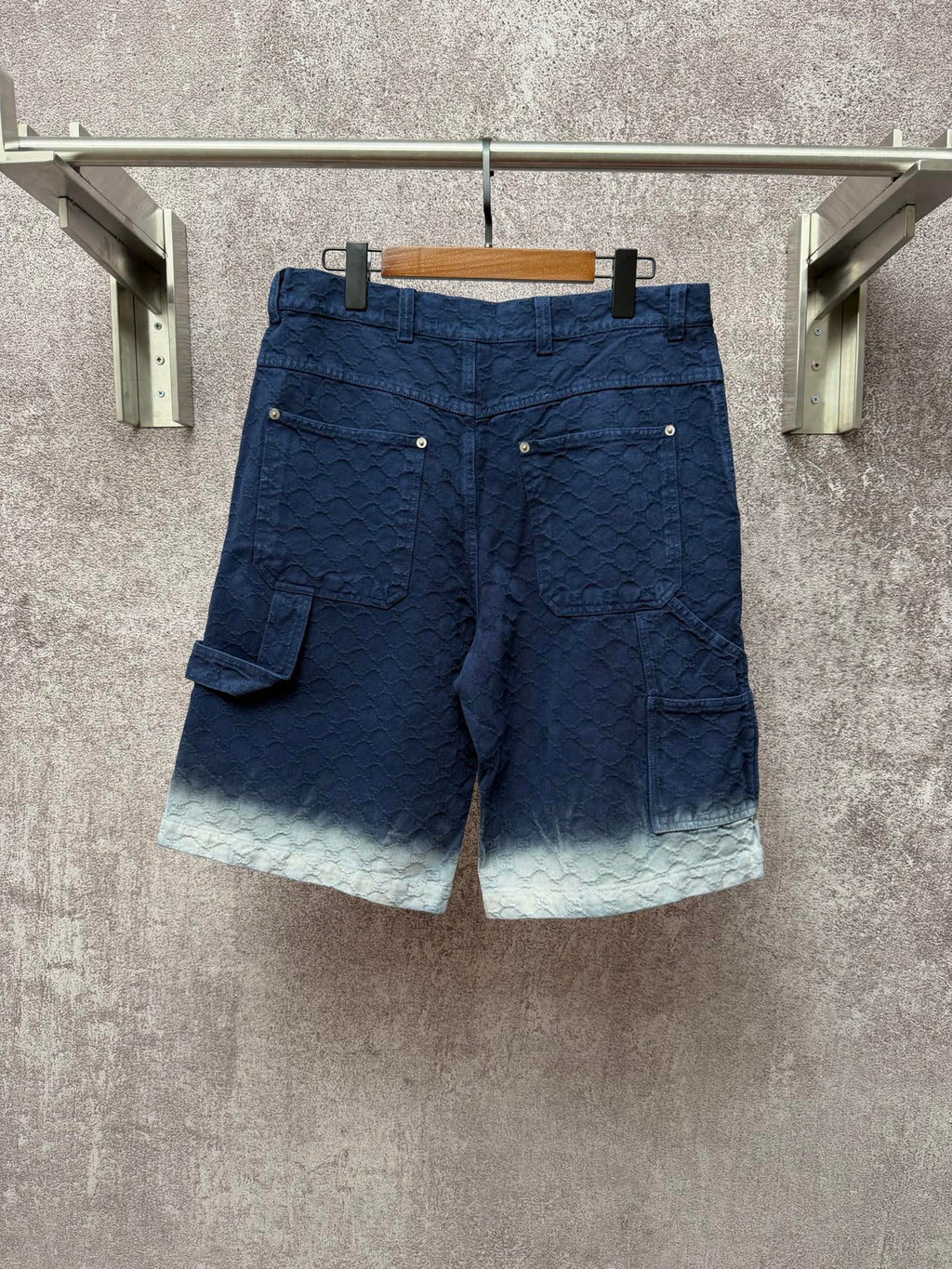 Gucci navy shorts with quilted texture and side cargo pocket, light ombre hem