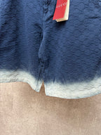Gucci navy shorts with quilted texture and light ombre hem, button detail at front