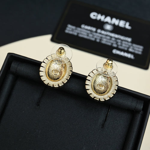 Gold-tone round logo stud earrings with red enamel and crystal border