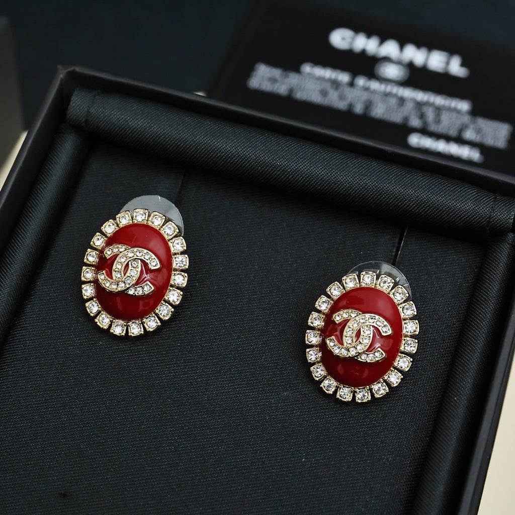 Red enamel logo stud earrings with silver-tone crystal halo detailing