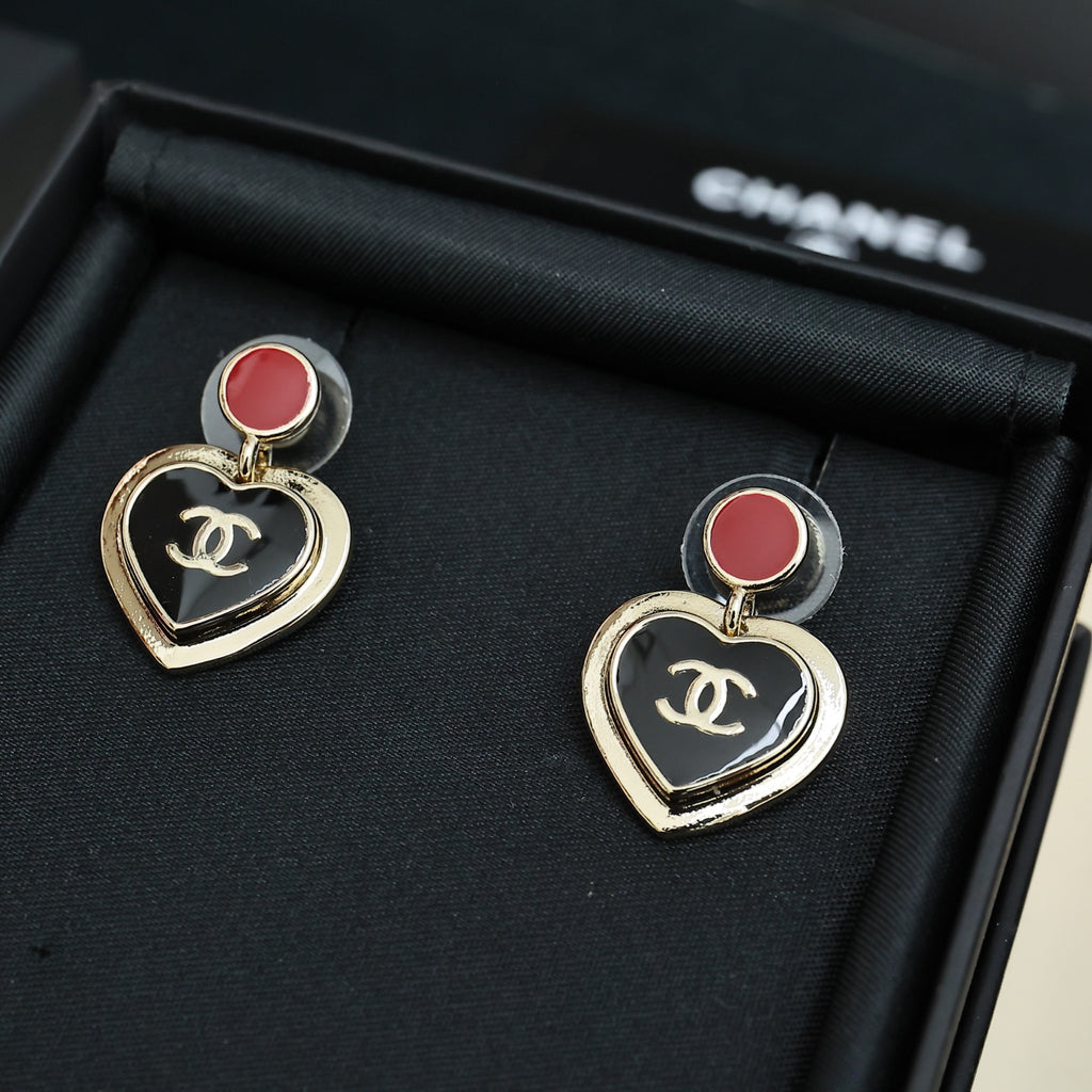 Heart dangle earrings with red enamel stud and gold-tone CC logo on black heart charms