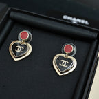 Heart dangle earrings with red enamel stud and gold-tone CC logo on black heart charms