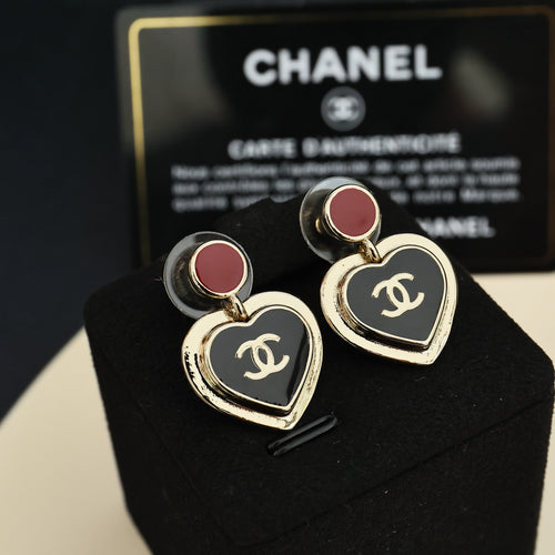 Heart dangle earrings with red enamel discs, gold-tone CC logo, and black enamel hearts