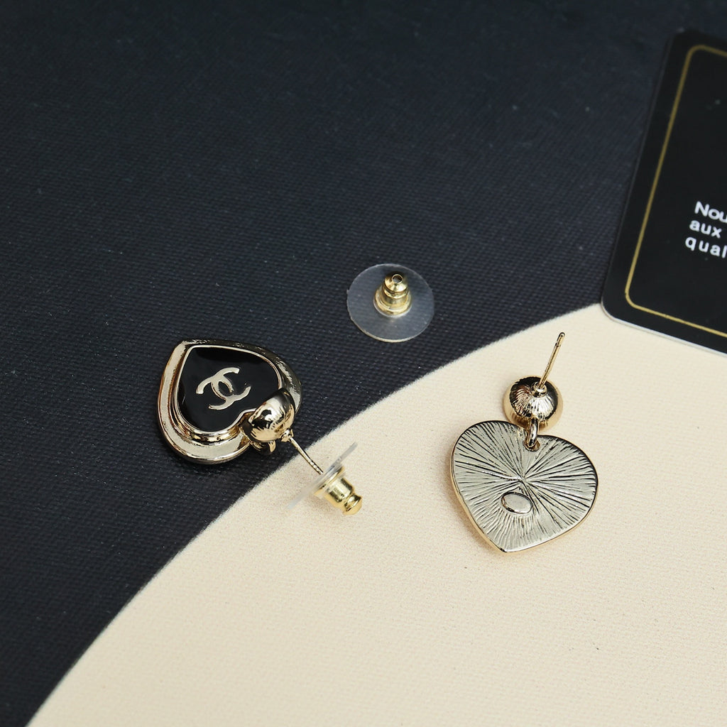 Mixed heart earrings: black CC heart with stud and silver textured heart on gold posts