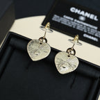 Textured heart drop earrings with silver-tone heart plates and gold-tone posts