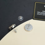 Round silver-tone stud earring backs with screw posts