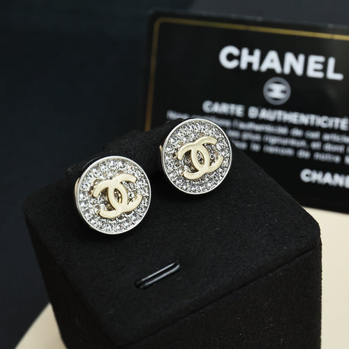CC stud earrings, round silver-tone with pavé border and gold CC center