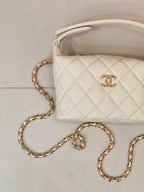 Chanel quilted mini bag, white, with gold chain strap and Chanel logo detail