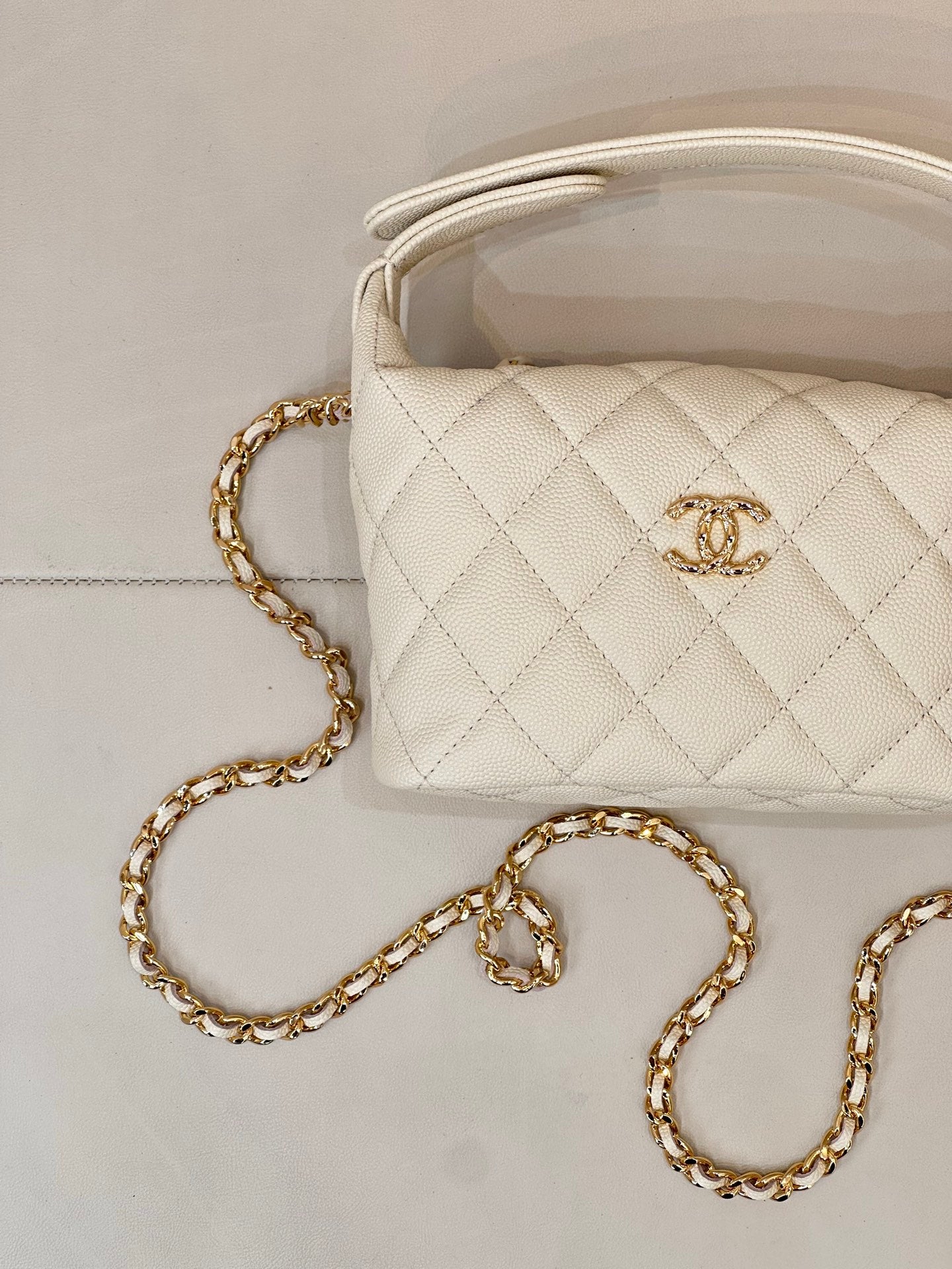 Chanel quilted mini bag, white, with gold chain strap and Chanel logo detail