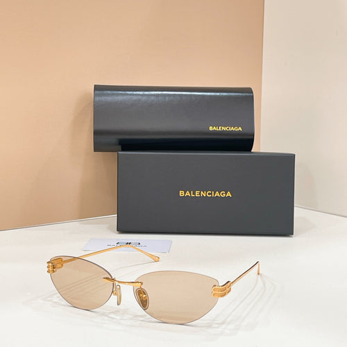 Sunglasses with light brown tinted lenses and gold-tone frames