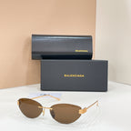 Sunglasses with amber tinted lenses and gold-tone frames
