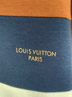Blue fabric stripe with yellow text reading LOUIS VUITTON PARIS