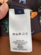 Care label for long-sleeve jacket: gentle dry clean, iron inside out