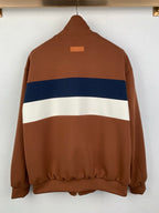 Brown zip-up jacket, back view with blue and white stripe across the torso