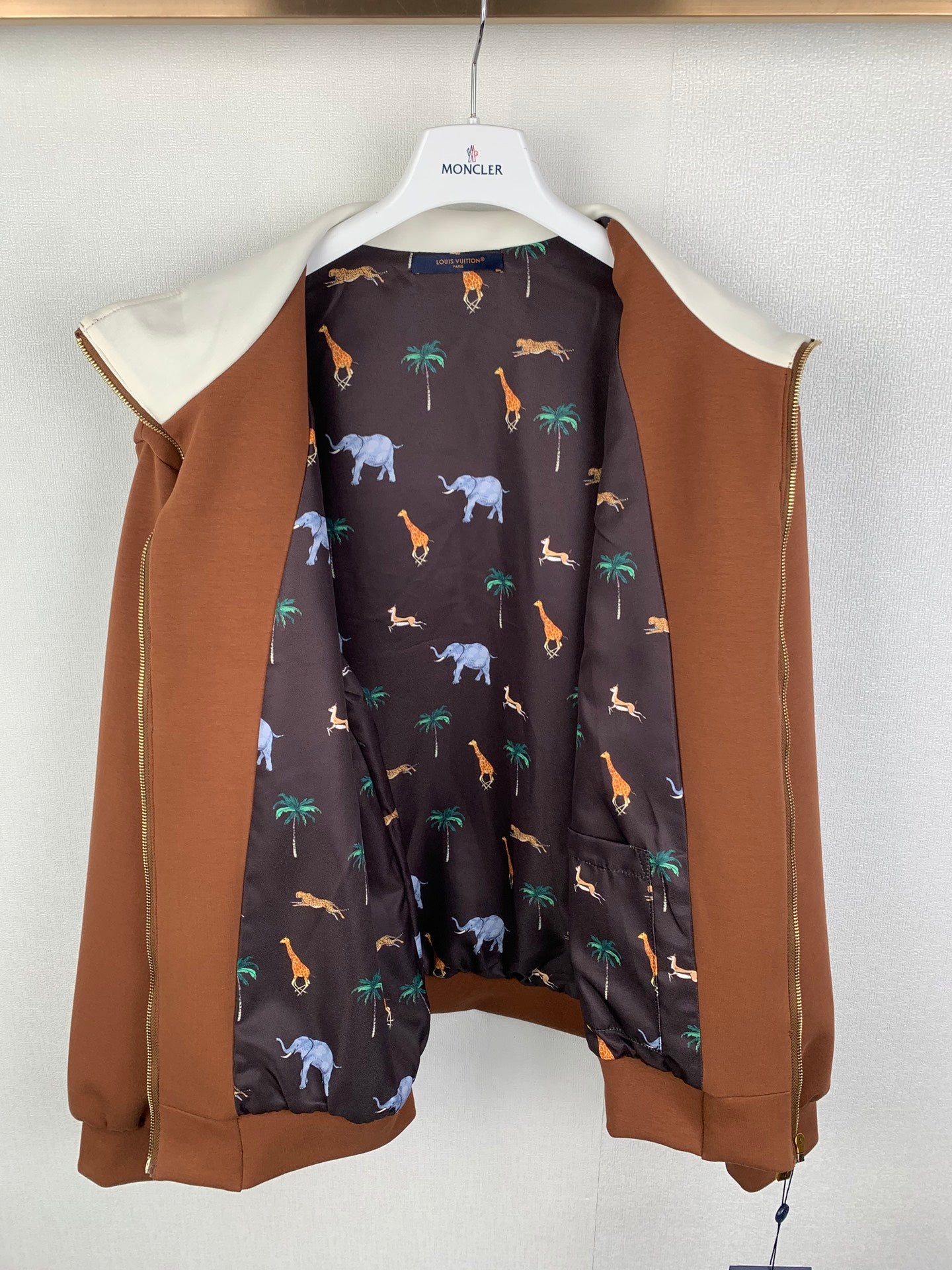 Long-sleeve jacket with brown outer and dark animal-print lining, open front
